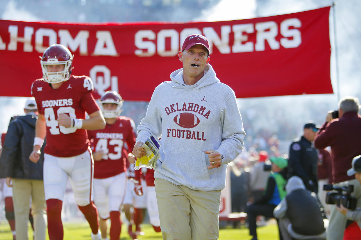 NORMAN, OKLAHOMA - NOVEMBER 24:  Head coach Brent Venables of the Oklahoma Sooners runs onto the field for a game against the TCU Horned Frogs at Gaylord Family Oklahoma Memorial Stadium on November 24, 2023 in Norman, Oklahoma.  Oklahoma won 69-45. (Photo by Brian Bahr/Getty Images)