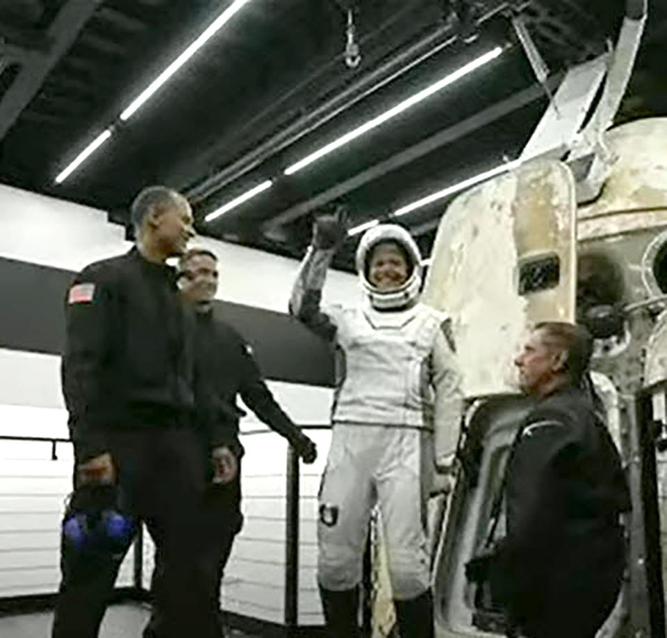 In this image taken from video, Sian Proctor, one of four passengers aboard the SpaceX capsule, reacts after emerging from the capsule Saturday, Sept. 18, 2021, after it was recovered following its splashdown in the Atlantic off the Florida coast. The all-amateur crew was the first to circle the world without a professional astronaut. (Inspiration4 via AP)