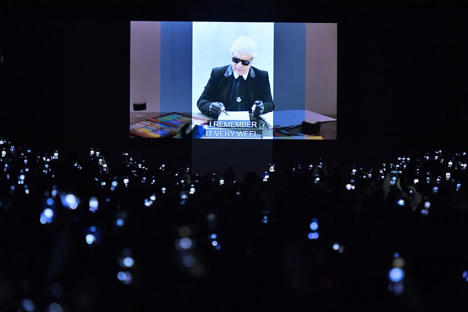 Guests at the Fendi fall 2019 show watch the house's tribute to its late creative director, Karl Lagerfeld.