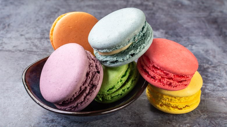 colorful macarons in bowl