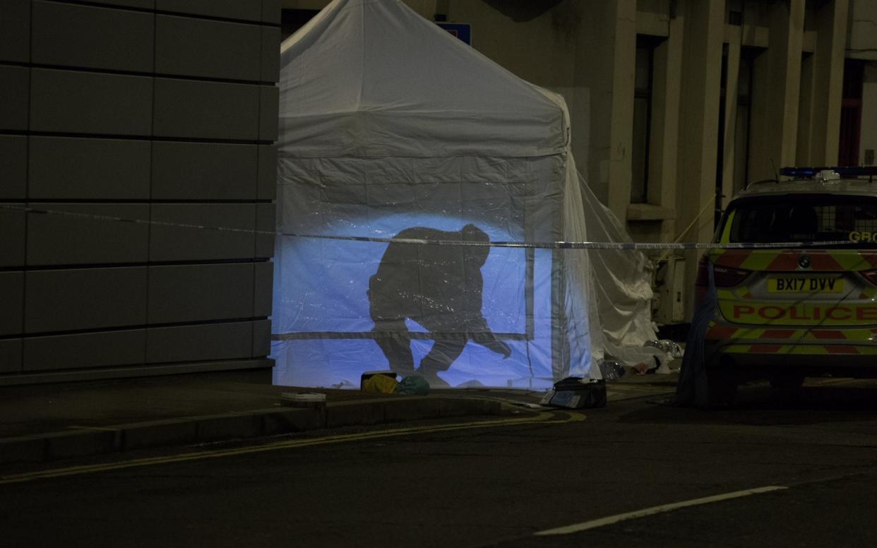 A police cordon after a knife crime incident in London - SWNS.com