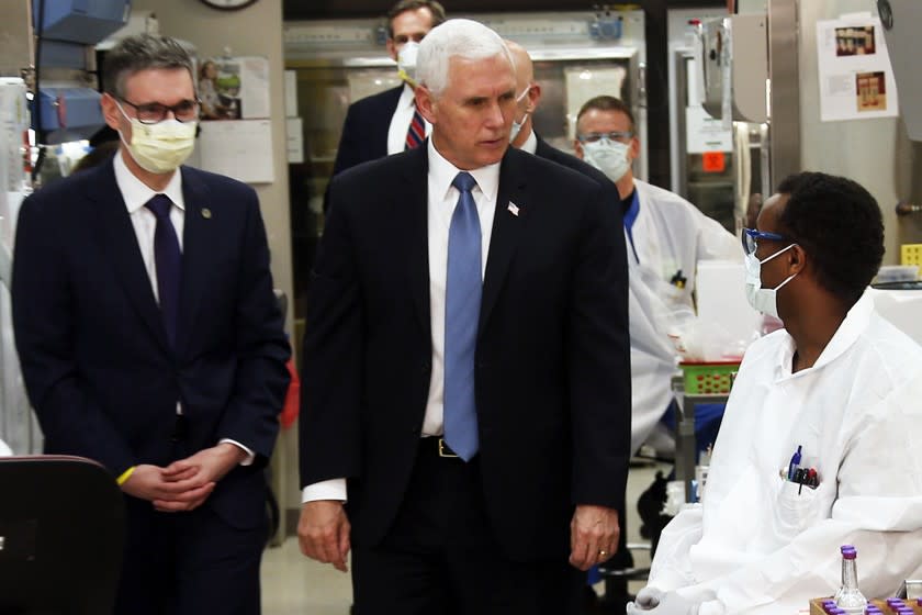 Vice President Mike Pence visits the molecular testing lab at Mayo Clinic in Rochester, Minn., on Tuesday.