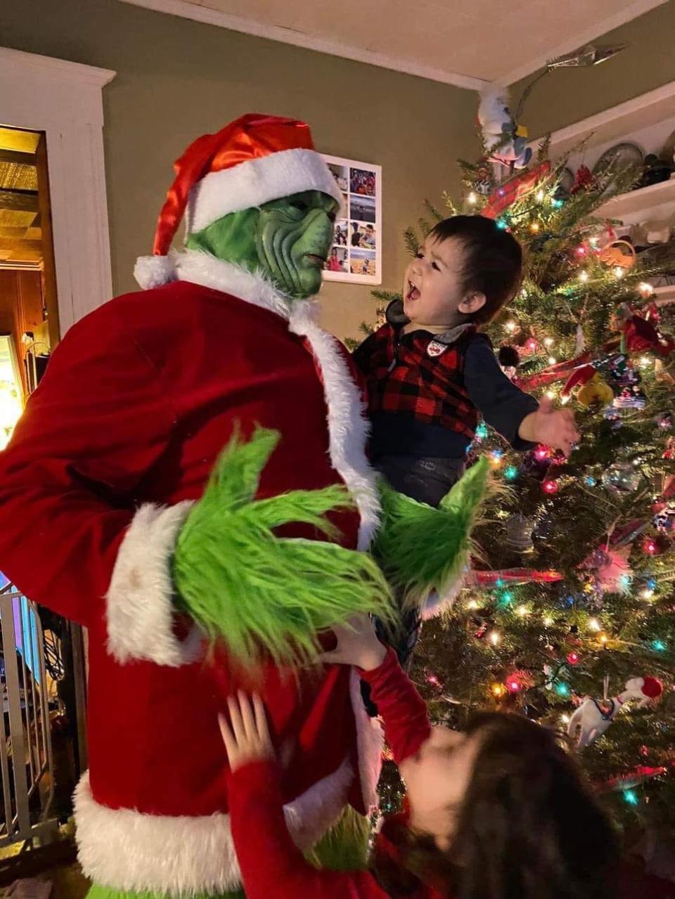 Ian Grigorio of Milton dressed up as the Grinch on Dec. 6, 2023. Grigorio started dressing up as the Grinch to help and friend and the idea just took off from there. People book Grigorio for parties and local events.