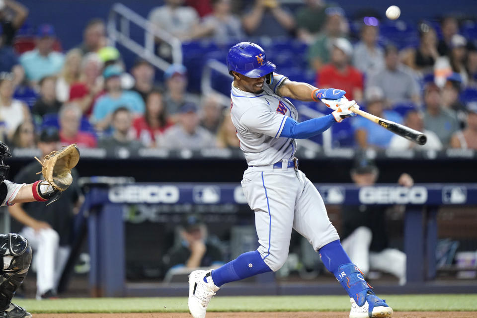 New York Mets' Francisco Lindor flies out during the first inning of a baseball game against the Miami Marlins, Sunday, June 26, 2022, in Miami. The Marlins won 3-2. (AP Photo/Lynne Sladky)