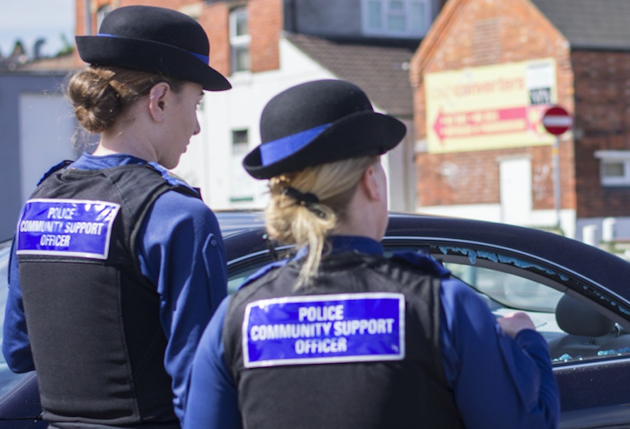 Police community support officers at the scene in Swindon, Wiltshire (SWNS)