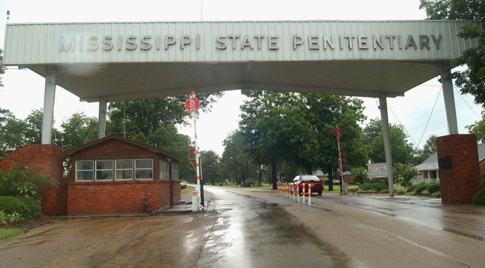 FILE - This is a July 12, 2002 file photo of the entrance to the Mississippi State Penitentiary at Parchman, Miss. The Justice Department has opened a civil rights investigation into the Mississippi prison system after a string of inmate deaths in the past few months, officials said Wednesday, Feb. 5, 2020. (AP Photo/Rogelio Solis, File)