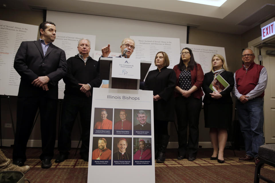 Attorney Jeff Anderson speaks as attorney Marc Pearlman, left, and clergy abuse victims listen during a news conference, Wednesday, March 20, 2019, in Chicago. Advocates for clergy abuse victims say their list of 395 priests or lay people in Illinois who have been publicly accused of sexually abusing children is far more extensive than the names already released by the state's six dioceses. (AP Photo/Kiichiro Sato)