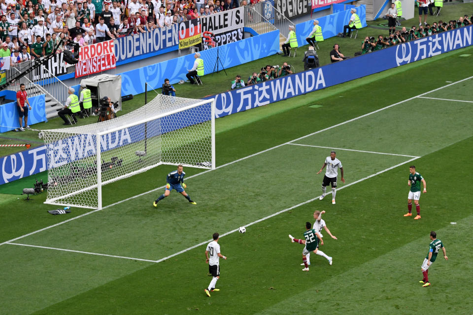 <p>Hirving Lozano of Mexico scores his team’s first goal under pressure from Toni Kroos of Germany during the 2018 FIFA World Cup Russia group F match between Germany and Mexico at Luzhniki Stadium on June 17, 2018 in Moscow, Russia. (Photo by Dan Mullan/REMOTE/Getty Images) </p>