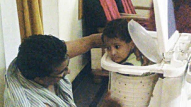 The boy, 2, became stuck after he climbed into the machine when his mother wasn't looking. Photo: ANI