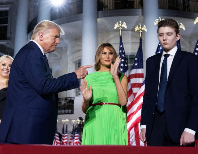 WASHINGTON, DC – AUGUST 27: U.S. President Donald Trump (L) gestures toward first lady Melania Trump and his son Barron Trump after delivering his acceptance speech for the Republican presidential nomination on the South Lawn of the White House August 27, 2020 in Washington, DC. Trump gave the speech in front of 1500 invited guests. (Photo by Chip Somodevilla/Getty Images)