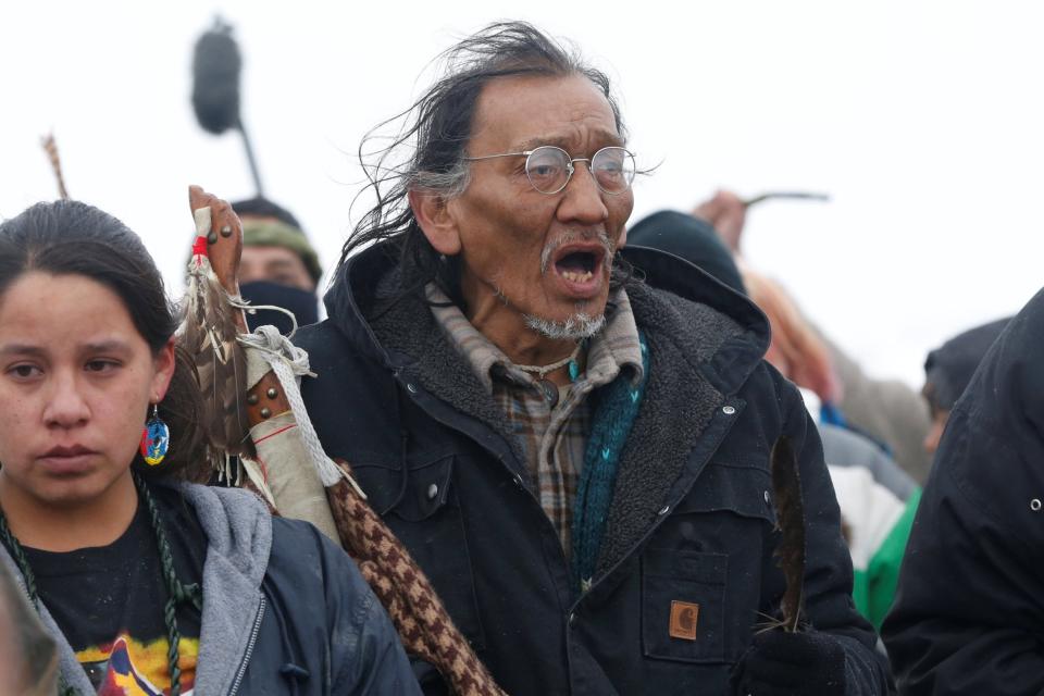 Nathan Phillips marches with other protesters out of the main opposition camp against the Dakota Access oil pipeline in 2017 (REUTERS)