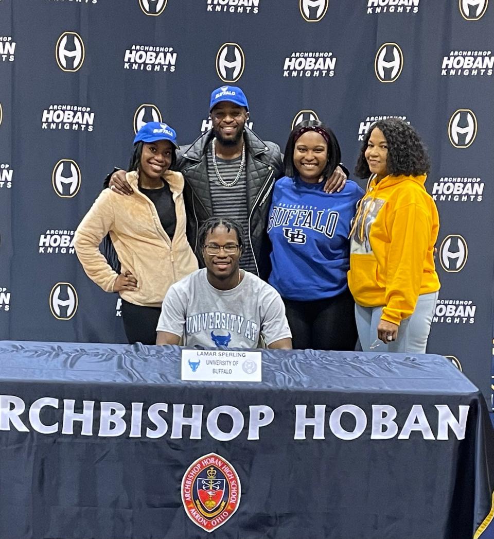 Archbishop Hoban senior running back Lamar Sperling with family during the school's national signing day ceremony. Ohio's Mr. Football, Sperling signed in December with the University at Buffalo.