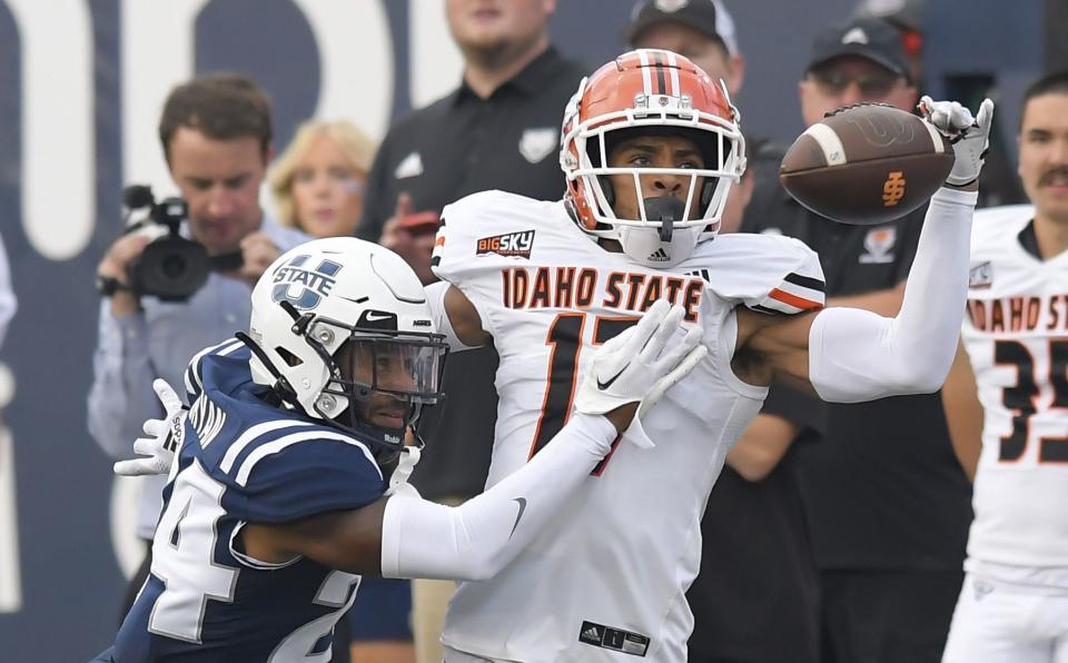 Utah State cornerback Gabriel Bryan, left, breaks up a pass intended for Idaho State wide receiver Cyrus Wallace during the first half of an NCAA college football game Saturday, Sept. 9, 2023, in Logan, Utah. | Eli Lucero/The Herald Journal via AP