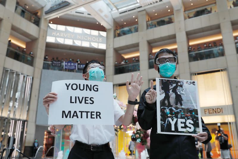 Pro-democracy demonstrators stage a rally at a shopping mall in Hong Kong