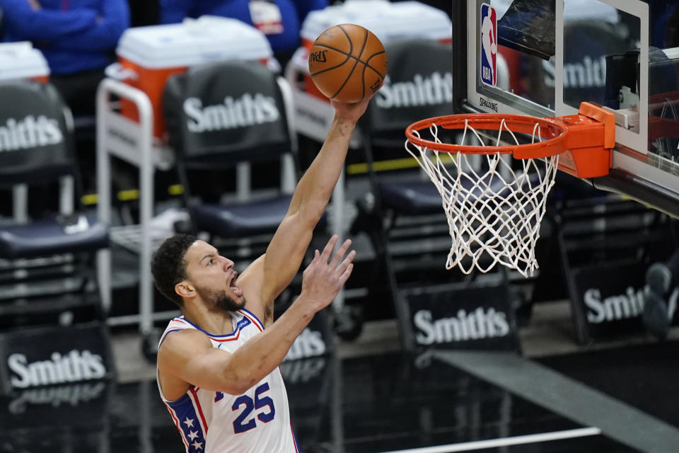 Philadelphia 76ers guard Ben Simmons (25) lays the ball up in the first half during an NBA basketball game against the Utah Jazz Monday, Feb. 15, 2021, in Salt Lake City. (AP Photo/Rick Bowmer)