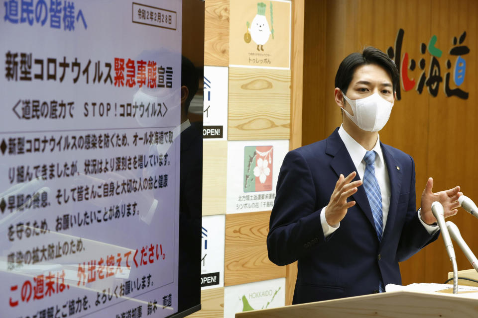 Hokkaido Gov. Naomichi Suzuki speaks at a press conference at the Hokkaido Government in Sapporo, northern Japan Friday, Feb. 28, 2020. The Japanese island of Hokkaido is declaring a state of emergency over the rapid spread of the new virus there. (Yohei Fukai/Kyodo News via AP)