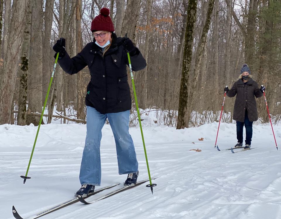 Debbie McMillan, front, and Wendy Clark, cross-country ski on Saturday at Quail Hollow State Park. Stark Parks offers equipment rentals and instructions this winter on certain dates weather permitting.