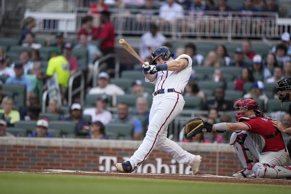 Atlanta Braves catcher Sean Murphy (12) singles in the first inning of a baseball game against the Philadelphia Phillies, Sunday, May 28, 2023, in Atlanta. (AP Photo/Brynn Anderson)