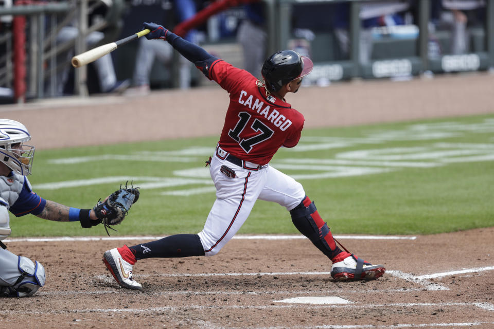 Atlanta Braves' Johan Camargo (17) hits a solo home run in the fifth inning of a baseball game against the New York Mets Sunday, Aug. 2, 2020, in Atlanta. (AP Photo/Brynn Anderson)