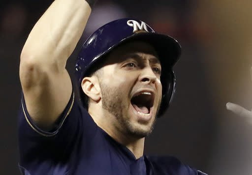 Milwaukee Brewers’ Ryan Braun celebrates after hitting a solo home run during the second inning of a baseball game against the St. Louis Cardinals, Monday, Sept. 24, 2018, in St. Louis. (AP Photo/Jeff Roberson)