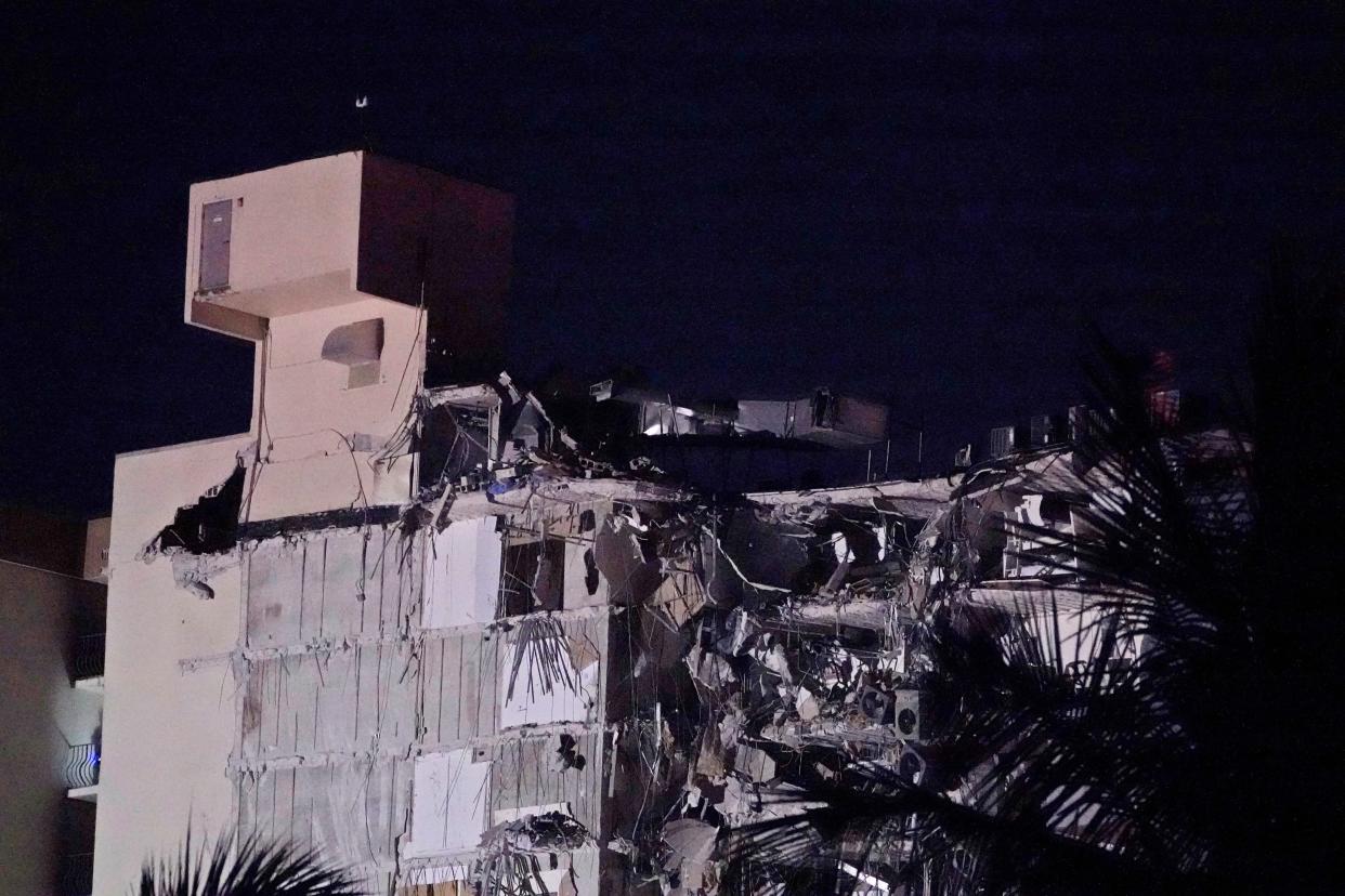 A partial collapsed building is seen early Thursday, June 24, 2021, in Surfside area of Miami, Fla.