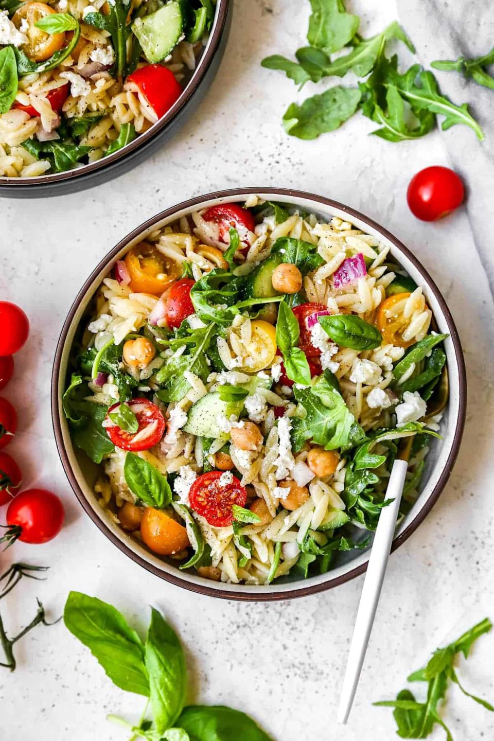 <p>Light, fresh, herby, cheese—this orzo salad makes a perfect side for pretty much any summer entrée.</p> <p>Get the recipe <a href="https://www.twopeasandtheirpod.com/easy-orzo-salad/" rel="nofollow noopener" target="_blank" data-ylk="slk:here;elm:context_link;itc:0;sec:content-canvas" class="link ">here</a>.</p>