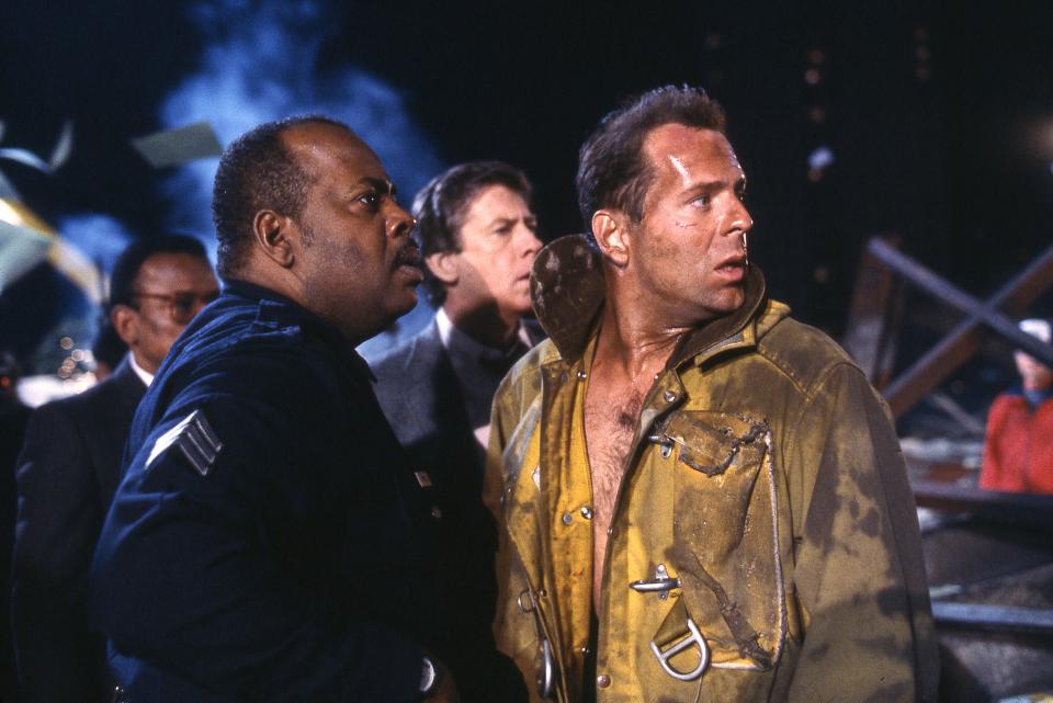 Reginald VelJohnson, left, and Bruce Willis in a scene from "Die Hard." The film is streaming on Peacock in time for the Christmas season.