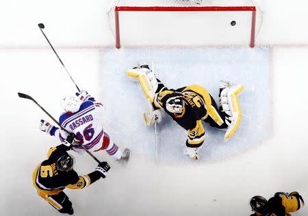 New York Rangers center Derick Brassard (16) celebrates after scoring a goal against Pittsburgh Penguins goalie Jeff Zatkoff (37) during the second period in game two of the first round of the 2016 Stanley Cup Playoffs at the CONSOL Energy Center. The Rangers won 4-2. Mandatory Credit: Charles LeClaire-USA TODAY Sports