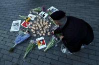 A demonstrator lights candles at a protest in Birmingham, Britain March 24, 2017. REUTERS/Eddie Keogh