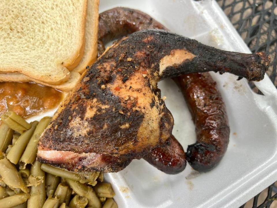 Chicken and a sausage link with baked beans and green beans from the Sausage Shoppe April 25, 2023.