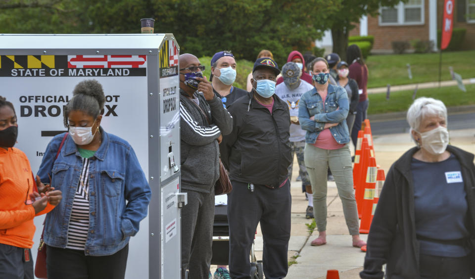 Voters line up at Northwood Elementary before the polls open for the primary election Tuesday, June 2, 2020 in Baltimore. (Jerry Jackson/The Baltimore Sun via AP)