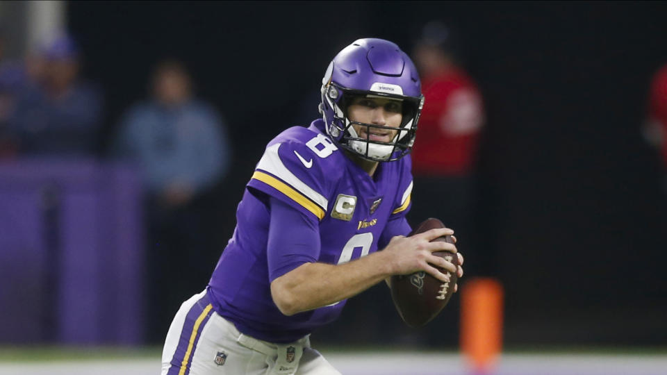 FILE - In this Nov. 17, 2019, file photo, Minnesota Vikings NFL quarterback Kirk Cousins throws against the Denver Broncos during an NFL football game in Minneapolis. The Vikings and Cousins have agreed to a two-year contract extension. Cousins' agent Mike McCartney made the announcement on his verified Twitter account. T (AP Photo/Jim Mone,File
