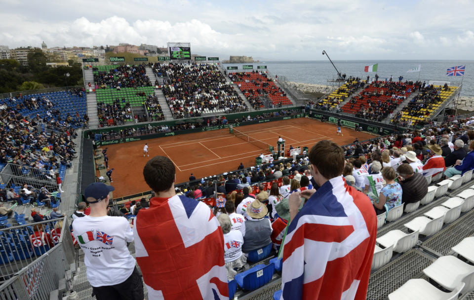 Spectators watch the Davis Cup World Group quarterfinal match between Italy's Fabio Fognini Britain's James Ward, in Naples, Italy, Friday, April 4, 2014. (AP Photo/Salvatore Laporta)