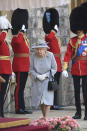 Britain's Queen Elizabeth II during a ceremony to mark her official birthday at Windsor Castle, Windsor, England, Saturday June 12, 2021. In line with government advice The Queen's Birthday Parade, also known as Trooping the Colour, will not go ahead in its traditional form. (Eddie Mulholland/Pool via AP)