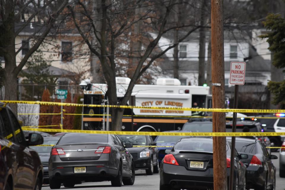 Police investigate a Sunday morning shooting at a home on Chatham Place in Linden that left two adults and two children dead.