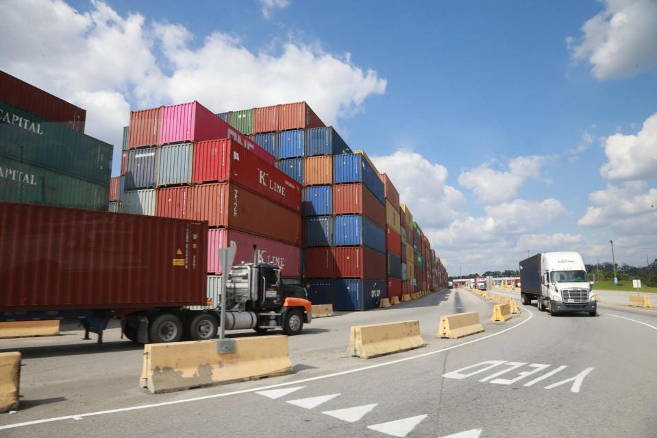 Trucks move containers around at the Georgia Ports Authority.