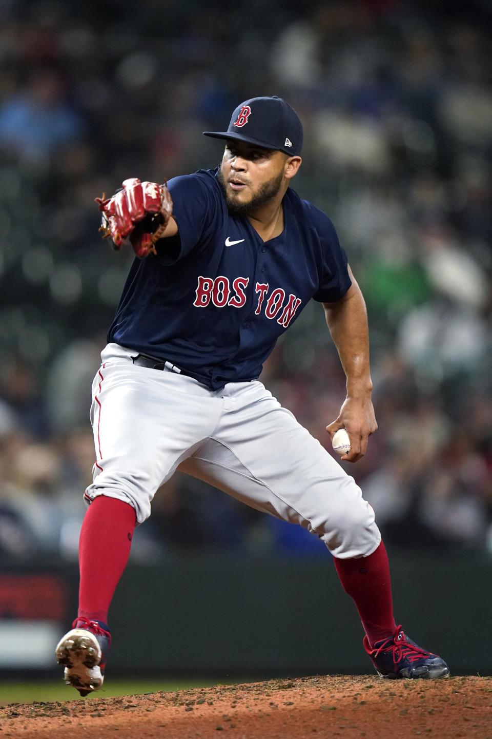 Boston Red Sox relief pitcher Darwinzon Hernandez throws to a Seattle Mariners during the sixth inning of a baseball game Tuesday, Sept. 14, 2021, in Seattle. (AP Photo/Elaine Thompson)