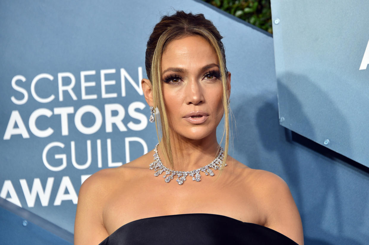 Jennifer Lopez is getting ready for her Super Bowl performance and showing off those sculpted abs. (Photo: Gregg DeGuire/Getty Images)