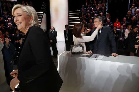 Candidates for the 2017 presidential election Francois Fillon, former French Prime Minister, member of the Republicans and candidate of the French centre-right, and Marine Le Pen, French National Front (FN) political party leader prepare before a debate organised by French private TV channel TF1 in Aubervilliers, outside Paris, France, March 20, 2017. REUTERS/Patrick Kovarik/Pool