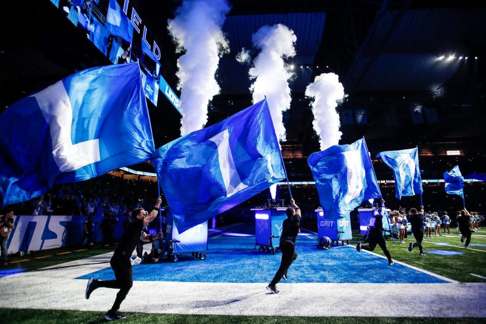 The Detroit Lions cheer squad takes the field before a game against Denver Broncos at Ford Field in Detroit on Saturday, Dec. 16, 2023.