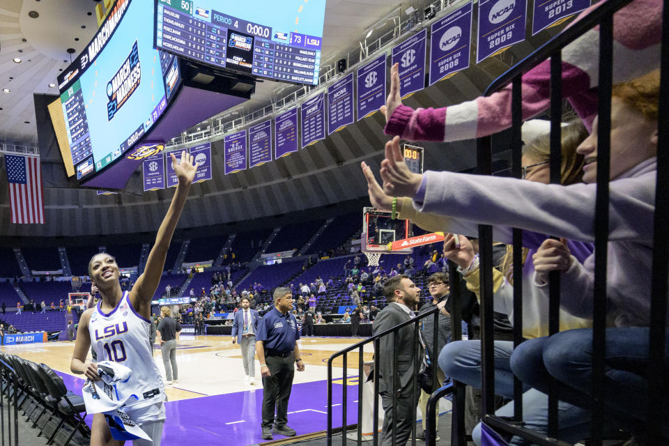 LSU forward Angel Reese (10) waves to the crowd after the team's win over Hawaii in a first-round college basketball game in the women's NCAA Tournament in Baton Rouge, La., Friday, March 17, 2023. (AP Photo/Matthew Hinton)