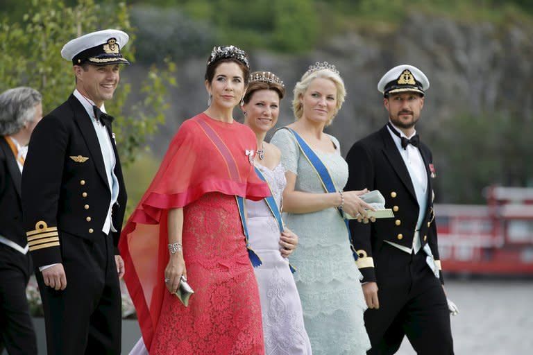 Royals walk after the wedding ceremony of Sweden's Princess Madeleine and New York businessman Christopher O'Neill in the Royal Chapel in Stockholm on June 8, 2013