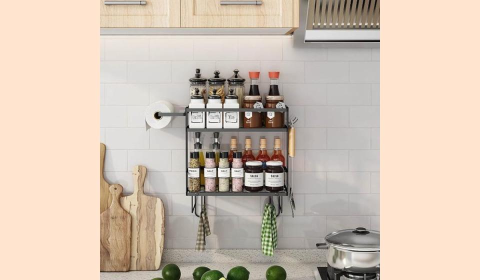 Kitchen with two-tiered storage caddy on the backsplash.