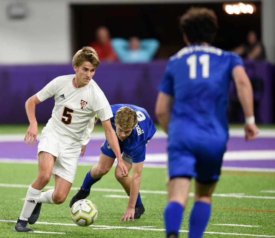 Tech junior Ethan Miller beats a Holy Angels defender Monday, Oct. 28, 2019, at US Bank Stadium for the Class A state semifinals. 