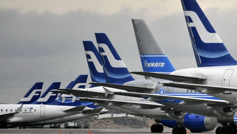 Passenger planes of the Finnish national airline company Finnair stand on the tarmac at Helsinki international airport in Helsinki on Nov. 16, 2009. The Finnish national carrier is asking aircraft passengers and their hand luggage to voluntarily hop on a scale to update the standard weights. The anonymous weighing of passengers takes place before boarding onto European and long-haul flights at departure gates at the Helsinki airport.