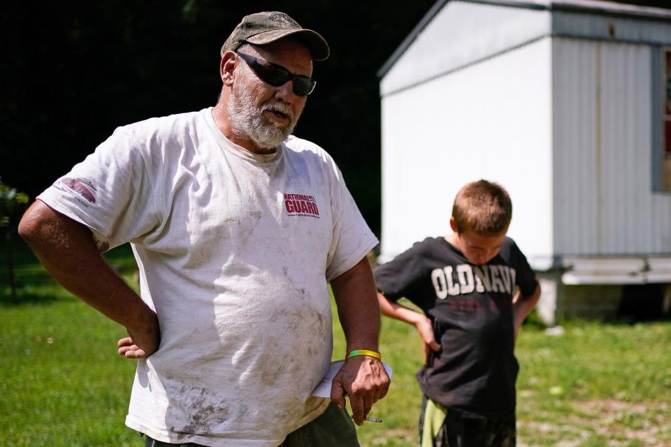 John Ross and his son David talk about their concerns for school reopening in the fall in light of the coronavirus pandemic and the way their limited internet access will hinder home instruction, in Beattyville, Ky., on July 29, 2020.