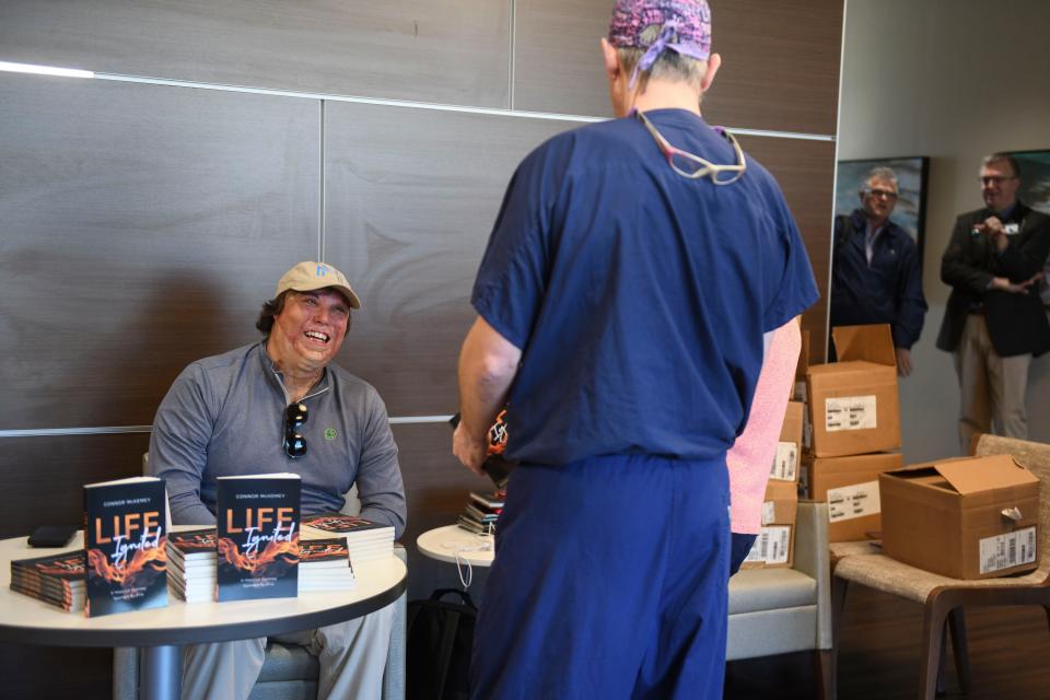 Author Connor McKemey signs copies of his book “Life Ignited: A Hopeful Journey Sparked by Fire” inside JMS Burn Center at Doctors Hospital of Augusta on Thursday, Jan. 18, 2024.