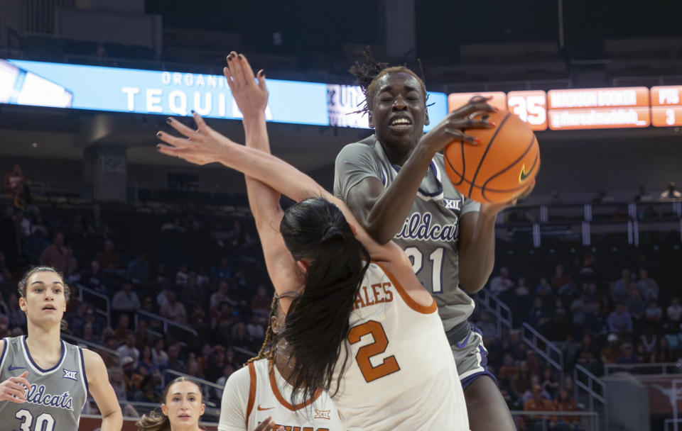 Kansas State forward Eliza Maupin, back, goes up for a shot against Texas guard Shaylee Gonzales, front, , during the first half of an NCAA college basketball game, Sunday, Feb. 4, 2024, in Austin, Texas. (AP Photo/Michael Thomas)