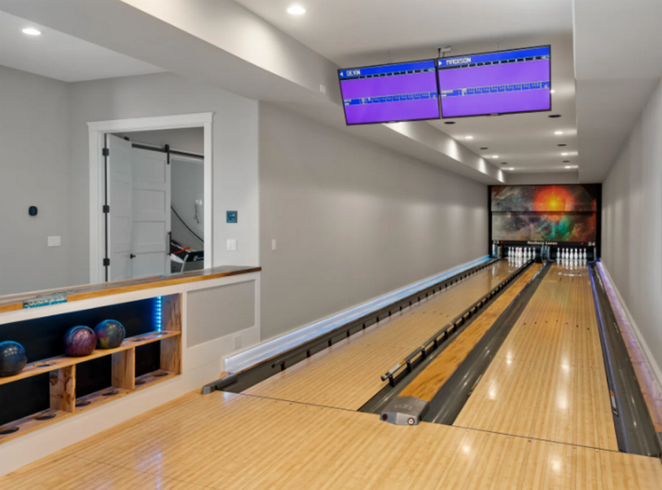 A two-lane bowling alley is featured in the riverside Pasco home.