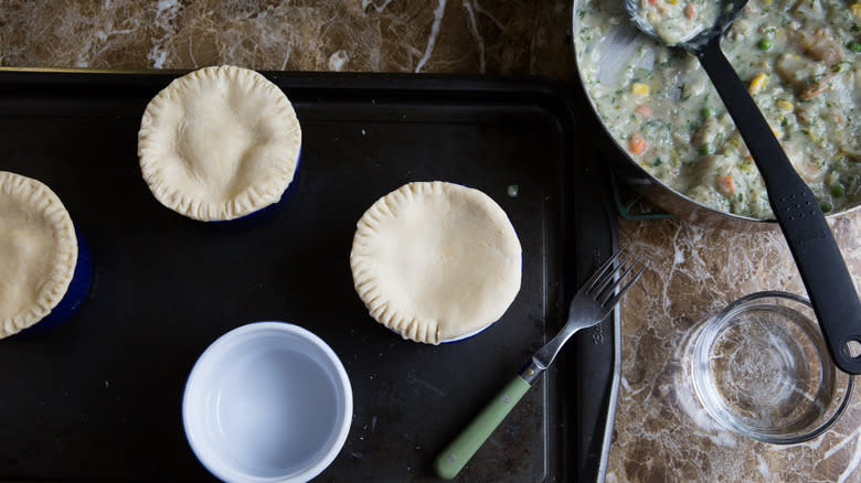 individual ramekins covered with dough